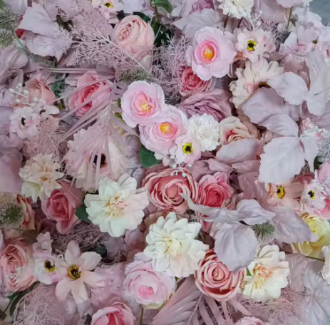 Penelope A vibrant arrangement of pink and white flowers with delicate green accents.